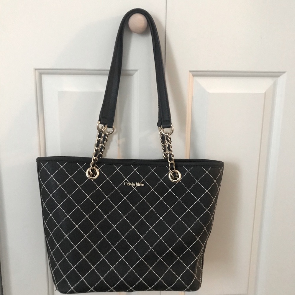 Calvin Klein bag with gold hardwares.